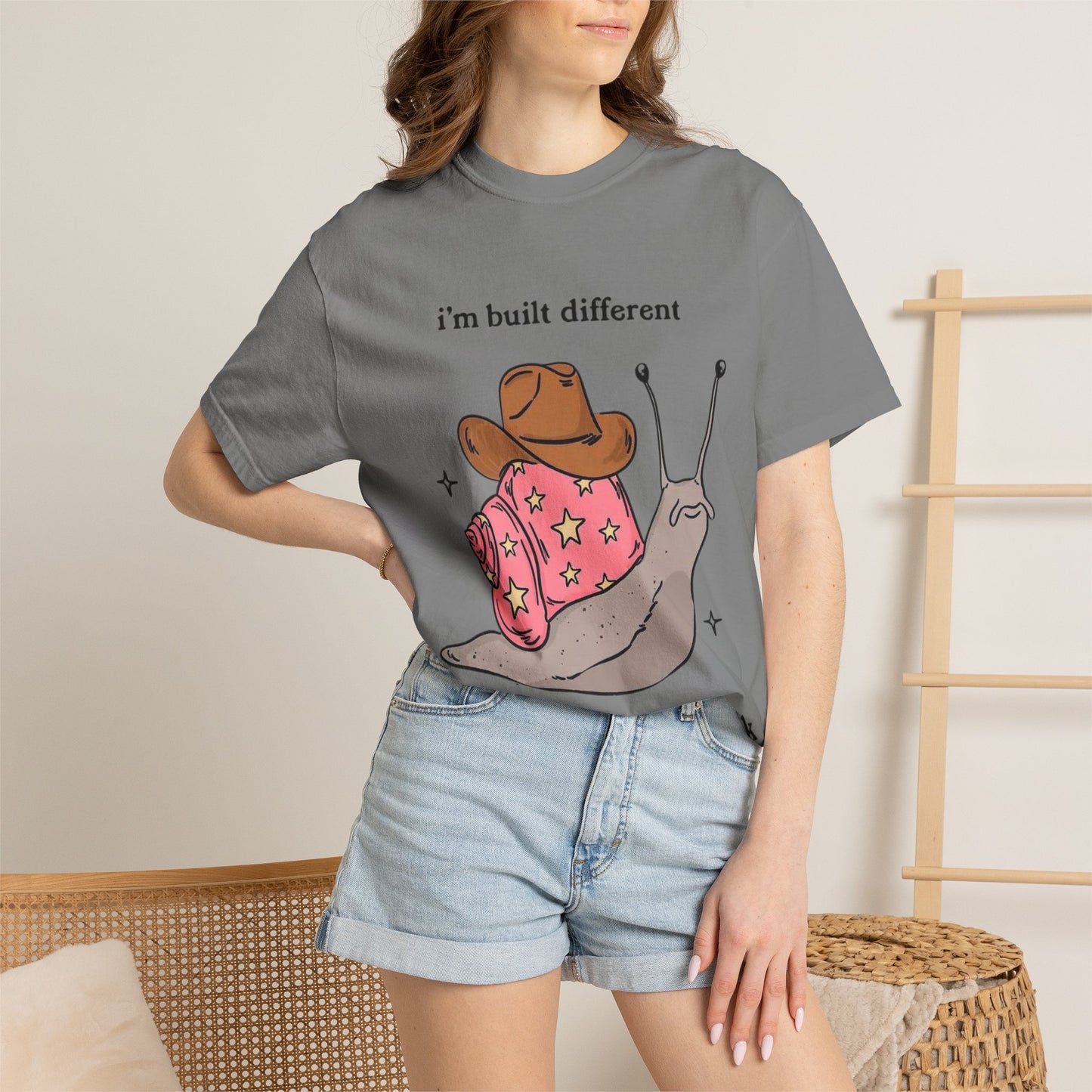 Snail Graphic T-Shirt — "i'm built different like incorrectly i think" Cute Cowpoke Shell Tee