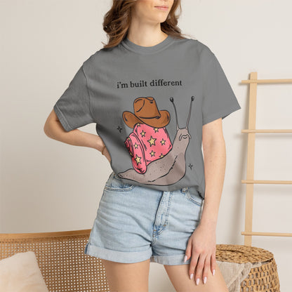 Snail Graphic T-Shirt — "i'm built different like incorrectly i think" Cute Cowpoke Shell Tee