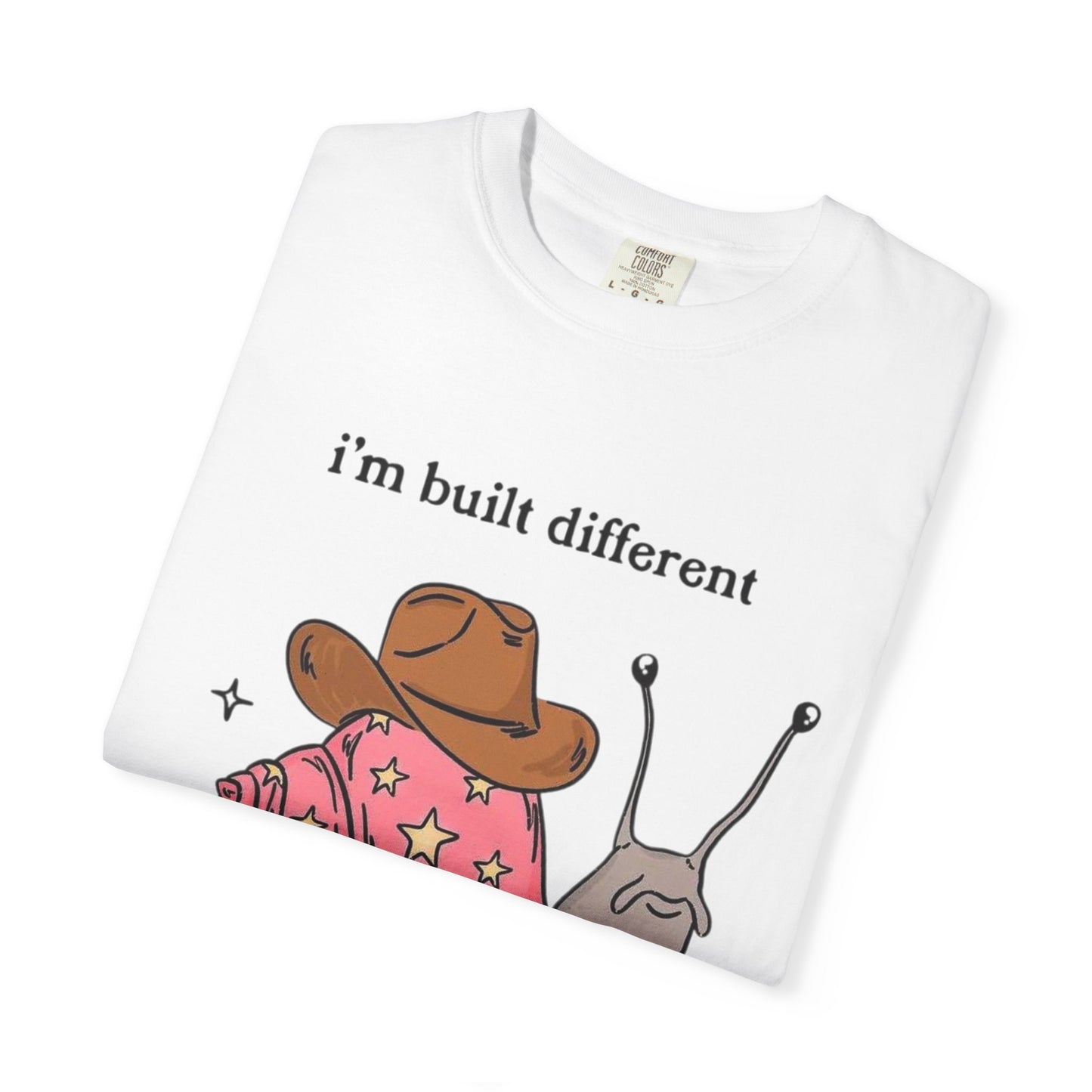 Snail Graphic T-Shirt — "i'm built different like incorrectly i think" Cute Cowpoke Shell Tee