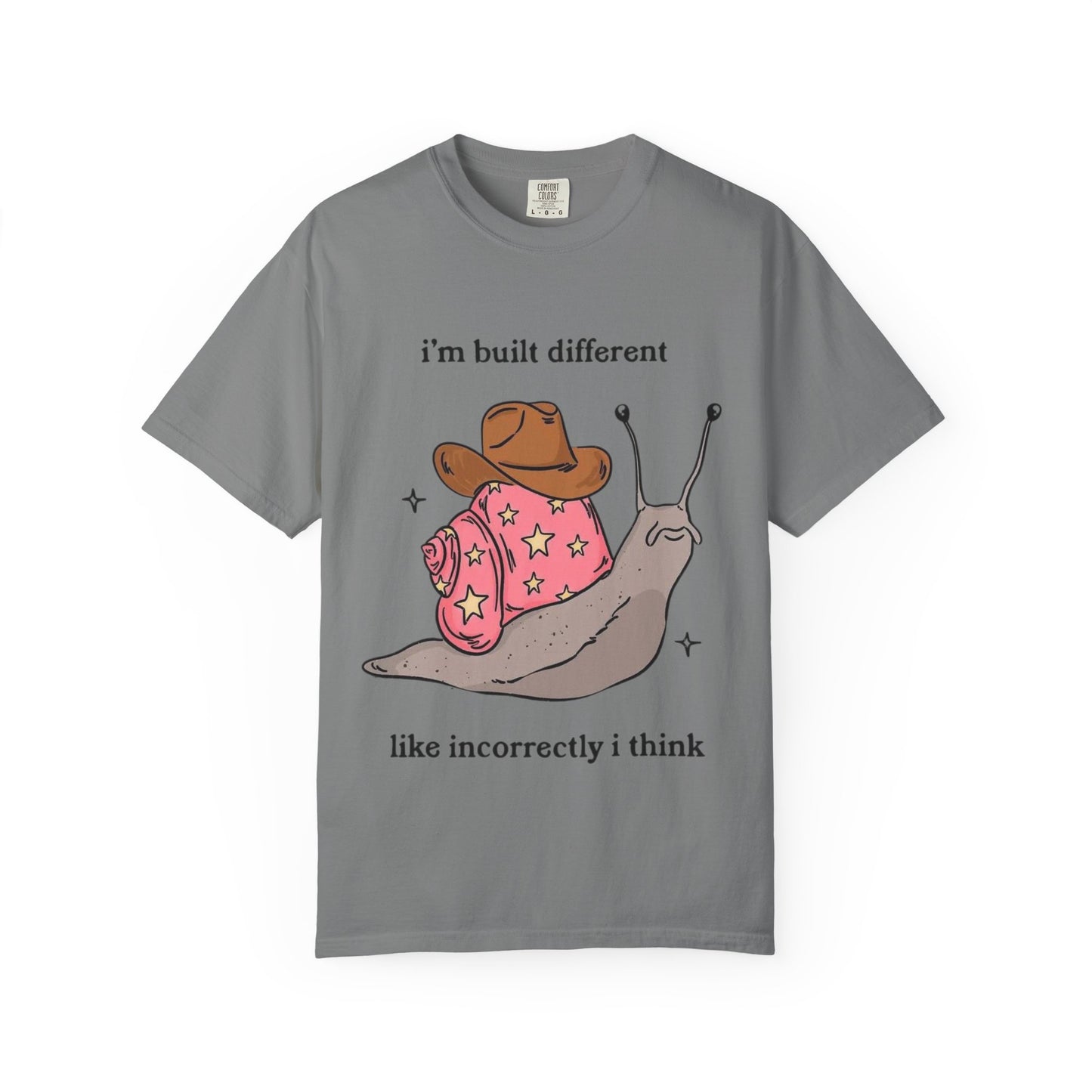 Snail Graphic T-Shirt — "i'm built different like incorrectly i think" Cute Cowpoke Shell Tee