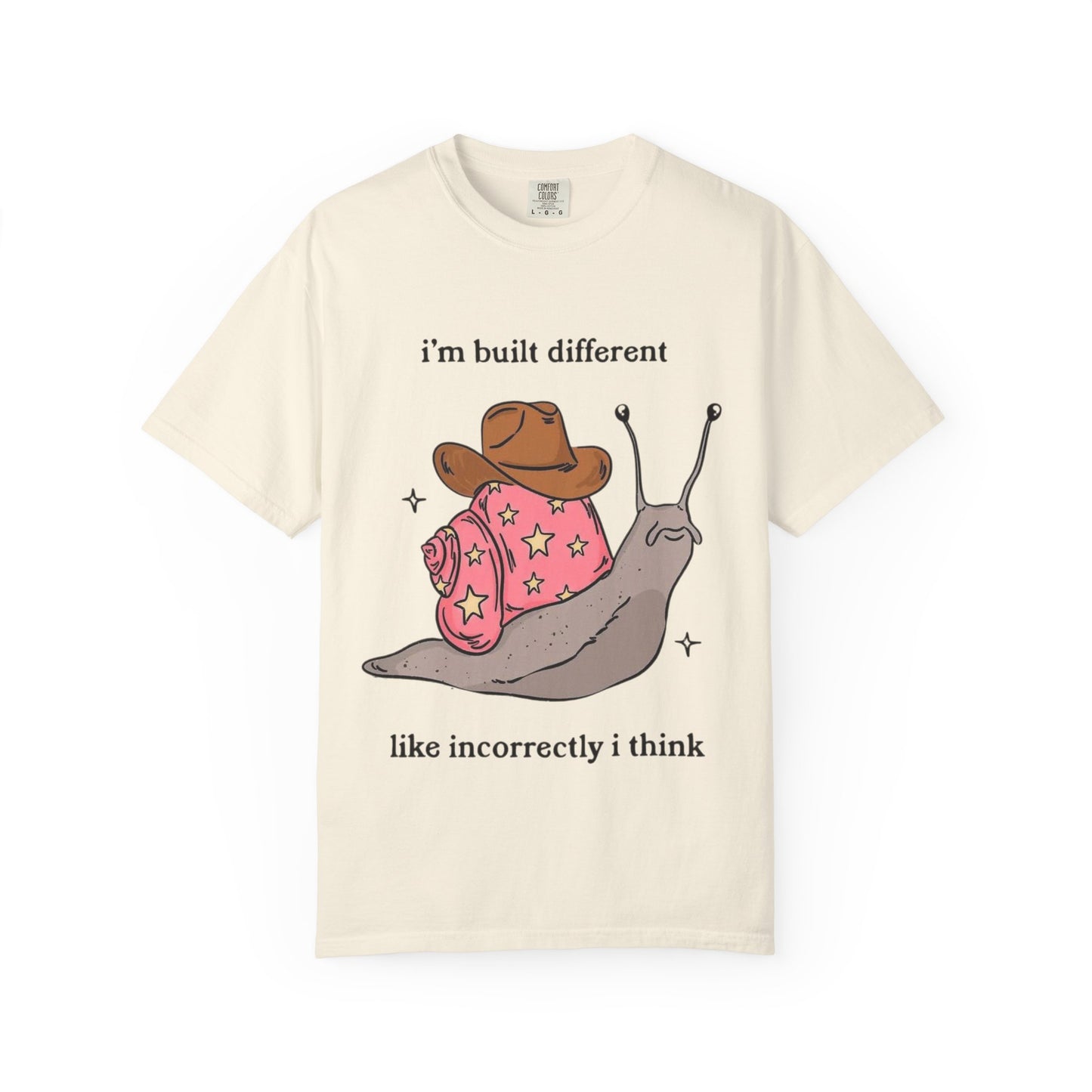 Snail Graphic T-Shirt — "i'm built different like incorrectly i think" Cute Cowpoke Shell Tee