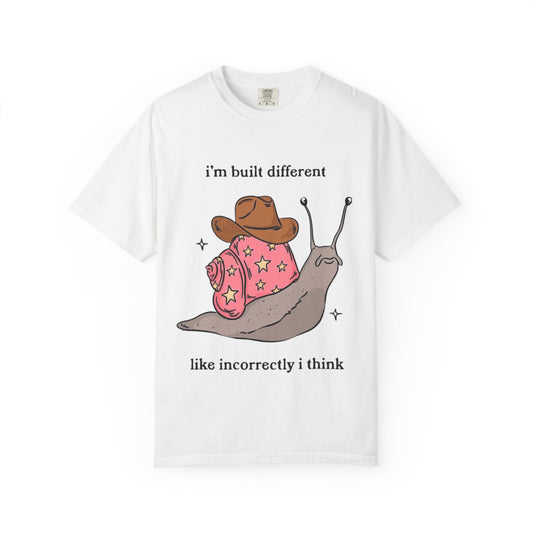 Snail Graphic T-Shirt — "i'm built different like incorrectly i think" Cute Cowpoke Shell Tee